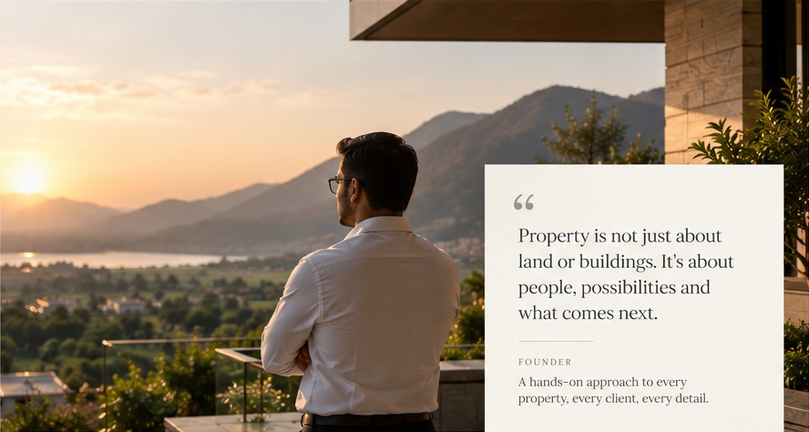 Man overlooking a mountain valley at sunset from a terrace